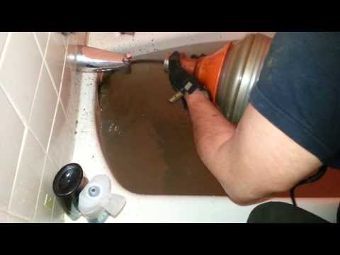 how to unclog standing water in a bathtub