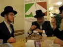 Joel Goldenberg serving dinner at Masbia before his wedding