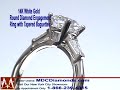 14 Karat White Gold Round Diamond Engagement Ring with Tapered Baguettes