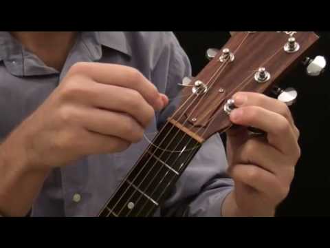 how to fasten classical guitar strings