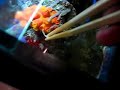 feeding Tubastraea faulkneri (orange cup coral)
