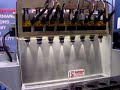 this shows how fuel injectors are cleaned on an off-car injector cleaning machine. 
the machine energizes the injectors as if they were running on the engine solvent flows through the injectors to remove fuel varnish deposits.