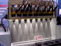 this shows how fuel injectors are cleaned on an off-car injector cleaning machine. 
the machine energizes the injectors as if they were running on the engine solvent flows through the injectors to remove fuel varnish deposits.