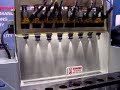 this shows how fuel injectors are cleaned on an off-car injector cleaning machine. 
the machine energizes the injectors as if they were running on the engine solvent flows through the injectors to remove fuel varnish deposits.