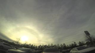 Time lapse of clouds going by at sunset