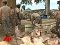 selectplusmissouri town wins battle against floodingmissouri town wins battle against floodingthe associated pressresidents in clarksville, missouri - with the help of hundreds of volunteers - mounted an epic-challenge to a historic flood threat.  ap correspondent jason bronis has more on how their efforts paid off.  (june 21)tracksuper: clarksville, mo.vo of downtown clarksville dry street.the hum you hear ...natspumps.trackvo of water pumps, sign, river.... is the sound of water pumps.in the town of clarksville, that's all you hear, and that's good.natssandbagging.tracksuper: wednesdayvo of people sandbagging along wall, wall, river. it was a frenzy of rushed preparations that brought hundreds of volunteers to this river community earlier this week.they built a flood wall from scratch, and it held.sotno super'we are so thankful.' // 'i think god's had a lot to do with it. i really do.'trackvo of woman, town, river.linda harmon is a 38 year resident and a town alderwoman.she's confident they've won the battle against the raging river.sotsuper: linda harmon/resident'there are people here to stop any seepage of water. everything is being watched very closely.'trackvo of metal flood walls, man, plastic flood walls, volunteers pouring sand. there are some high-tech tools on their side, too.dirt filled metal pens are said to be stronger than sandbags.al arellanes (are-lay-nuss) came from san francisco with rapid deployment flood walls - a product he invented.using the plastic channels filled with dirt, volunteers laid the equivalent of 30-thousand sandbags in just two hours.sotsuper: al arellanes/flood wall manufacturer 'everybody's getting tired now. they're kind of worn out. now's the time we really need to start concentrating because everything is getting saturated.
