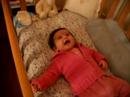 Myrto 4 months old laughs on her bed myrto_n
