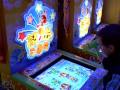 Video Game Arcade in China - Playing a digital Whac-A-Mole machine