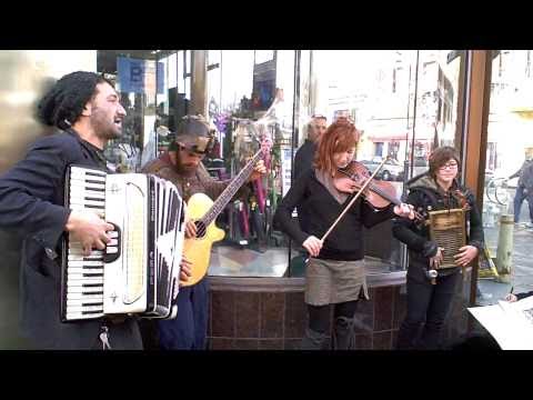 east european music - This was shot around xmas of 2010, when telegraph avenue is closed to automobiles, and becomes a street fair atmosphere for a couple of weeks. These kids loo...