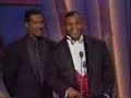 eddie murphy and mike tyson are honoring sammy davis jr., when eddie imitates mike.