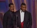 eddie murphy and mike tyson are honoring sammy davis jr., when eddie imitates mike.