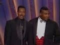 eddie murphy and mike tyson are honoring sammy davis jr., when eddie imitates mike.