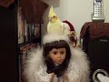 ANGEL AS SHE SINGS SILENT NIGHT WITH PIED COCKATIEL SITTING ON HER HEAD