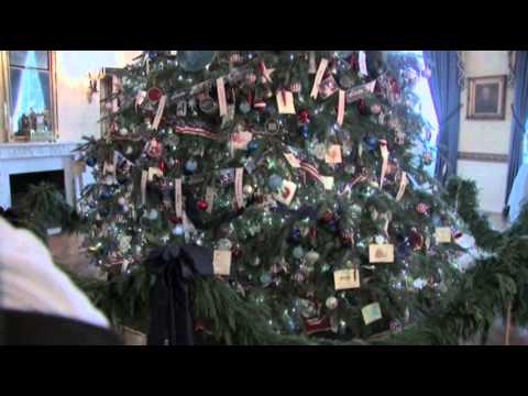 first - First Lady Michelle Obama honored military families Wednesday giving them the first glimpse of the White House's newly installed Christmas decorations. The W...