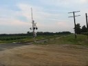 as i awaited the arrival of ns 15m the ns youngstown line dispatcher was heard setting up a meet between another unknown eastbound, the 15m (westbound) and a work train.  a headlight appeared in the distance and along came a train identifying itself as what sounded like 
