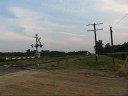 as i awaited the arrival of ns 15m the ns youngstown line dispatcher was heard setting up a meet between another unknown eastbound, the 15m (westbound) and a work train.  a headlight appeared in the distance and along came a train identifying itself as what sounded like 