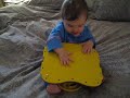 Savannah playing with a race car toy