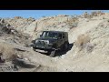 Stock JK Rubicon having a little fun on Cake Walk in Cougar Buttes California