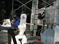 Ice Carvers Chainsaw an Alaska Native at the Ice Alaska 2009 Competition in Fairbanks Alaska