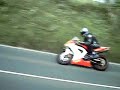 Isle of Man TT 2007. Last rider nearly sticks it in hedge! Isle of Man TT 2007. Last rider nearly sticks it in hedge!