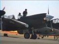 a restored ww2 p-40 static taxi flying and landing