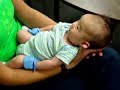A baby pooping--almost dropped!!!