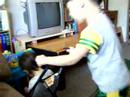 Our two kids with a doll stroller