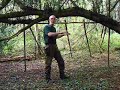 bushcraft survival group shelter under yew tree bushcraft survival group shelter under yew tree