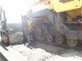 How do you pave asphalt up to a concrete bridge deck?