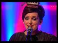 Julie Feeney performs as Ryan Tubridy's musical guest on the popular long running Irish TV chat show 'The Late Late Show'. She sings 'Impossibly Beautiful', the second single from her highly acclaimed second album 'pages'. As well as singing all of the vocals on the album, Julie self-produced it; orchestrated all of the music and conducted the orchestra on the recording. The head piece Julie wears here and in her live shows originated in Julies own designed pages artwork. The multi-coloured house that features on Julies pages art-work was painted when Julie kindly asked Sharon Costello Desmond to paint it in specific colours that Julie picked out. She definitely didnt want any black but rather a child-like hopefulness and fairytale playfulness. For Julies live performances, she had the desire to wear the house on her head and with the help of Dave Brittain asked Attack on Humans to make it basing it on her original artwork. Of course the running theme of fabulous headwear is evident in Julies award winning video for Impossibly Beautiful where she wears headpieces designed by Piers Atkinson.