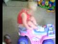 2 year old riding backwards on 4 wheeler