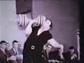 Paul Anderson one-arm presses 300 pounds.