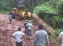 The Dozer finally gets the log hauled up the slope with a mighty effort- our new friend Ray is excited...several times