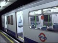 2 District Line trains at Embankment Stn