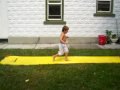 Playing on the slip 'N' slide.