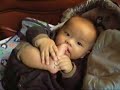 Cute baby boy  eating toe -  7 months old