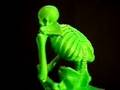 The Thinker skeleton statue -- Fluorescent Green