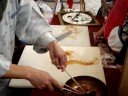 Guy making a caramel sculpture