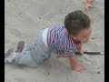 3 Year old whiffs from the sand with golf club