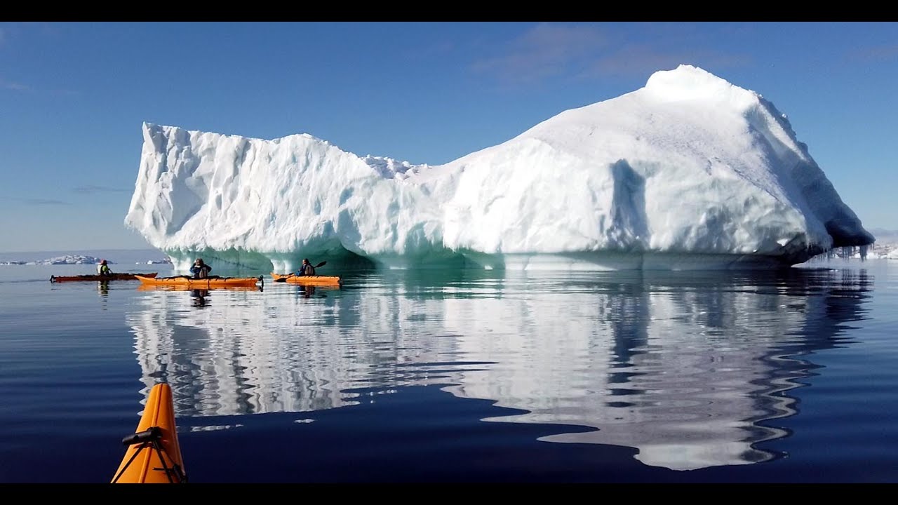 Guided sea kayak trip near Upernavik city, 17 June 2023., in Northwest Greenland, among icebergs