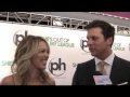 peter talks to jessica st. clair & hayes macarthur at the premiere of 