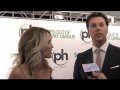 peter talks to jessica st. clair & hayes macarthur at the premiere of 