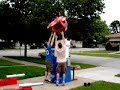 I have had quite a few people ask me just exactly how I get into a 10ft Transformers Optimus Prime costume. I figured I should upload this video and let everyone see.  Due to the size of the Optimus Prime costume, I sometimes feel like a scarecrow trapped in an Autobot.  The Optimus Prime costume is not incredibly comfortable to wear, but the reaction on the faces of people in the crowd is well worth it.