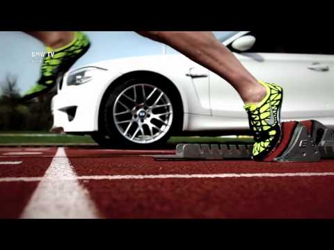 BMW 1M Coupe Races a Human Sprinter on Track