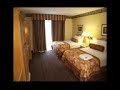 embassy suites north anaheim:easily accessible off the 91 freeway, the embassy suites north anaheim is located just six miles from the disneyland resort and anaheim convention center. this hotel in anaheim has numerous attractions nearby, including the block at orange, crystal cathedral, knott's berry farm, honda center, disney's california adventure park, angels stadium, downtown disney district, house of blues, adventure city theme park, eisenhower park, fulllerton arboretum and more. located near the 91 freeway, the embassy suites north anaheim is 15 miles from the orange county/john wayne airport and 36 miles from los angeles international airport. with 222 guest suites, the embassy suites north anaheim has many amenities that include separate living rooms and bedrooms, sofa beds, in-suite movies, wet bars, microwaves, tvs, coffeemakers, and more. featuring a 7-story garden atrium and koi fishponds, the embassy suites north anaheim serves business and leisure travelers in a tropical environment. amenities include a complimentary cooked-to-order breakfast, glass-enclosed heated pool, hot tub, fitness center, shuttle service to disneyland and the convention center, onsite dining options, and high-speed internet access. there is also a small conference room available for meetings.