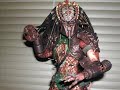 Heres my first video that I made. Slide show pictures of my Predator 2 Elder and Battle Damage Predator 2. I customized the Elder Predator 2 a bit, I added some of the quills that came with the AVP Elder on the eye bro area and lower jaws.  Cameo by AVP Elder Predator (for sale!!!...message me for info) and Regular Predator 2. Battle Damage Predator 2Whats Good:BD Predator 2 is very similar to the regular 14 inch Predator 2 figure except it comes with a lot more accessories including interchangeable mandibles (open so you can put on the mask or open), breathing mask, a med kit that opens up and best of all an alien skull which you see at the end of Predator 2 movie. Once again the figure is highly detailed and this time the med kit opens up revealing tiny tools the he uses to heal himself. The figure is also repainted with green blood on his mouth and armor. The hair is made of soft rubber which dangles down which i prefer unlike the AVP figures which are bendable. It was much easier to put together esp. the head compared to the AVP figures. At first i didnt know the figure comes with a mask but it does thats why i got both this and the regular Predator 2.Whats Bad:Theres really not much negative things to say about this figure except the paint could have been much better. The blood is not really visible. They could have made it glow in the dark or something, that would have been awesome.Elder Predator 2Whats Good:The head sculpt stands out the most out of all the Predator figures ever released from  Hot Toys. It just looks awesome! The comes with bone trophies and a pistol which he gives to Harigan at the end of the movie. The hair also dangles down and is made out of soft rubber. Again the figure was not challenging to put together.Whats Bad:The shin armor was really difficult to put on. Be careful not to snap anything when putting it on and void removing it when its already on cause once its on, theres no way that thing is coming off. Theres a big chance that shin armor will cause the mesh to sag up because it is a very tight fit. The figure does not come with a lot of accessories for the price that you pay.Overall:Both figures are great. Very pricey but worth every cent. Easier to assemble. I highly recommend both figures esp. Elder. He's my favorite one out of all the Predator figures.I apologize for any repeated pics. Like I said, its my first video.Enjoy!