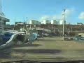 [V0113] 050108 北茨城市の磯原跨線橋から太平洋をちらちらと臨み海上延伸工事中の国道6号日立バイパスへ Japanese country roads; Hitachi Port