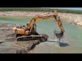 KOMATSU PC240 EXCAVATING FROM WATER