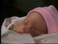 Tad holds his new daughter for the first time...