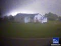 An ATM surveillance camera at the First State Bank in Parkersburg, Iowa, shows a house across the street being hit by an EF5 tornado with estimated winds of 205 mph.